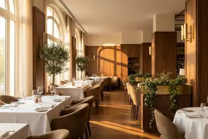 Hospitality photograph of a dining room in warm evening light